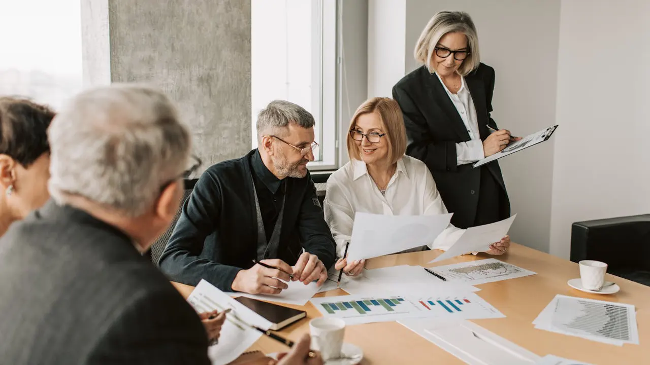 Team collaborating during a lead management audit meeting to assess and optimize lead handling processes.