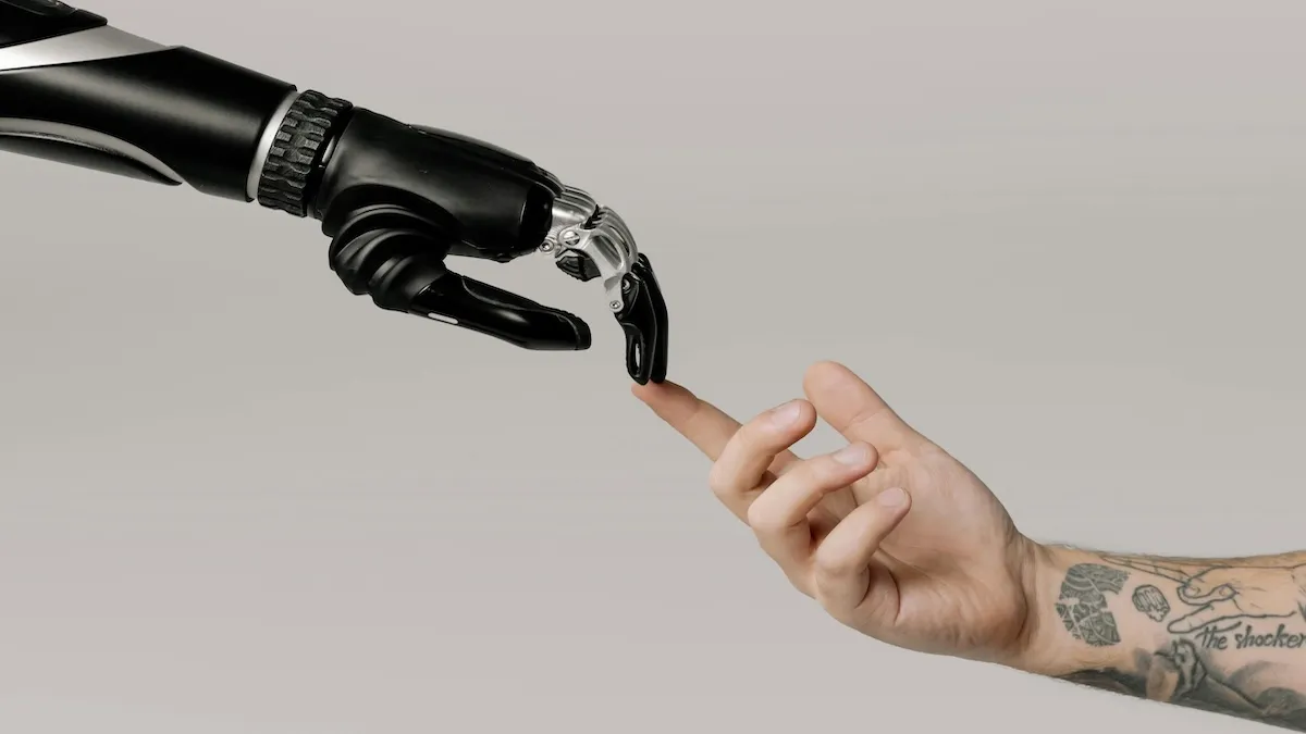 A robotic hand and a human hand reaching toward each other, symbolizing AI-human collaboration in B2B lead nurturing